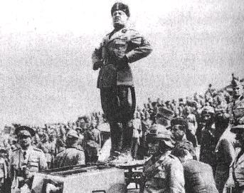 File:Mussolini standing on a tank.jpg