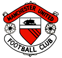 A football crest. In the centre is a shield with a ship in full sail above a red field with three diagonal black lines. Either side of the shield are two stylised roses, separating two scrolls. The upper scroll is red and reads